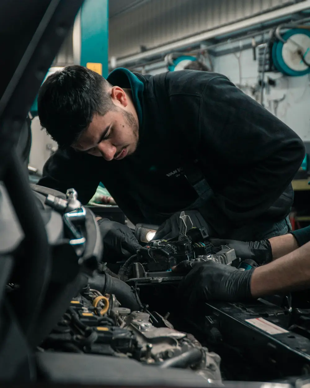 Technician running diagnostics on a vehicle