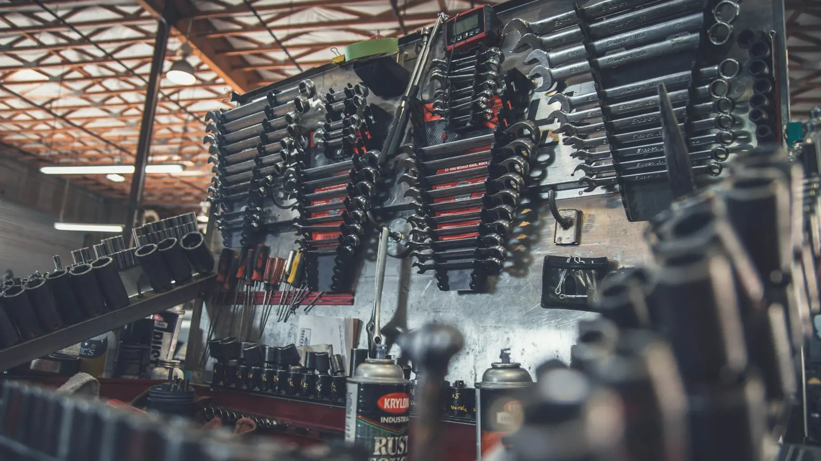 Mechanic's tools laid out on a workbench